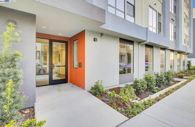 view of exterior entry featuring french doors