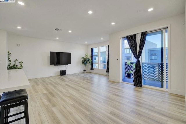 unfurnished living room featuring light hardwood / wood-style flooring