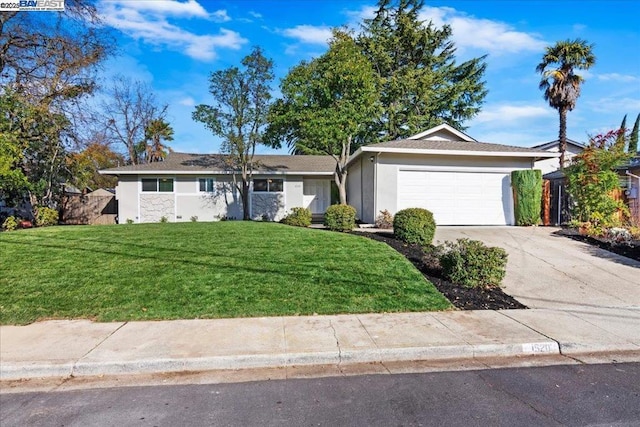 ranch-style house with a garage and a front yard