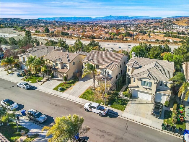 birds eye view of property featuring a mountain view