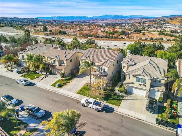 birds eye view of property with a residential view and a mountain view