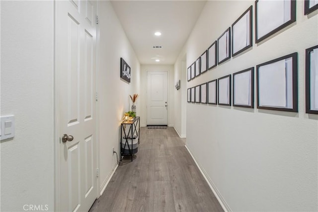 hallway featuring light hardwood / wood-style flooring