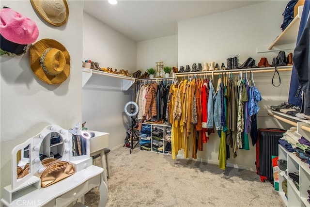 walk in closet featuring carpet