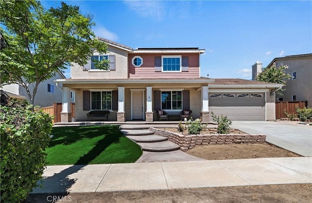 view of front of property with a porch and a garage