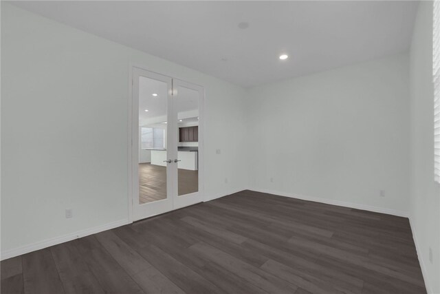 empty room featuring dark wood-type flooring