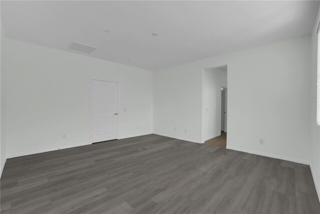 empty room featuring dark hardwood / wood-style floors