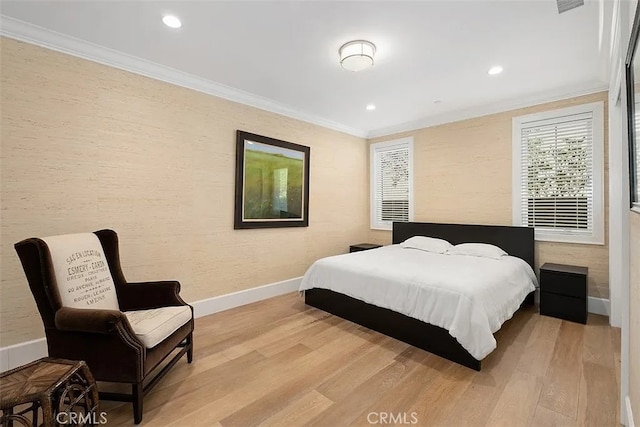 bedroom with light wood-type flooring and ornamental molding