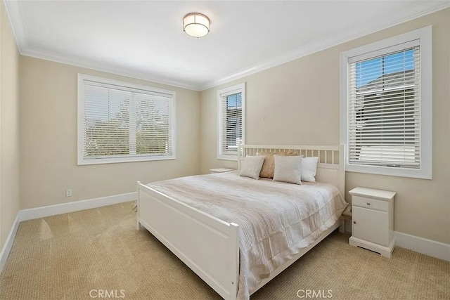 bedroom featuring light colored carpet and ornamental molding