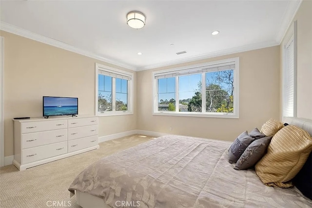 carpeted bedroom with ornamental molding and multiple windows