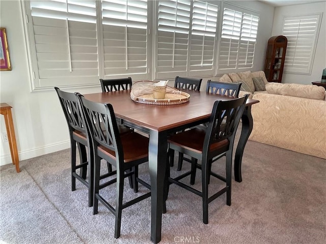 view of carpeted dining area