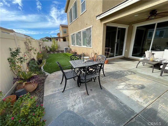 24445 Paxton Ln, Lake Elsinore, CA 92532 - view of patio / terrace featuring central air condition unit, ceiling fan, a fenced backyard, and outdoor dining space