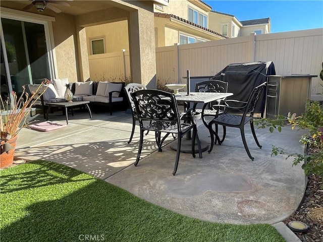 24445 Paxton Ln, Lake Elsinore, CA 92532 - view of patio with fence, a grill, outdoor dining area, an outdoor hangout area, and a ceiling fan