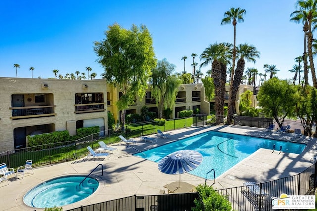 view of pool featuring a patio area and a community hot tub