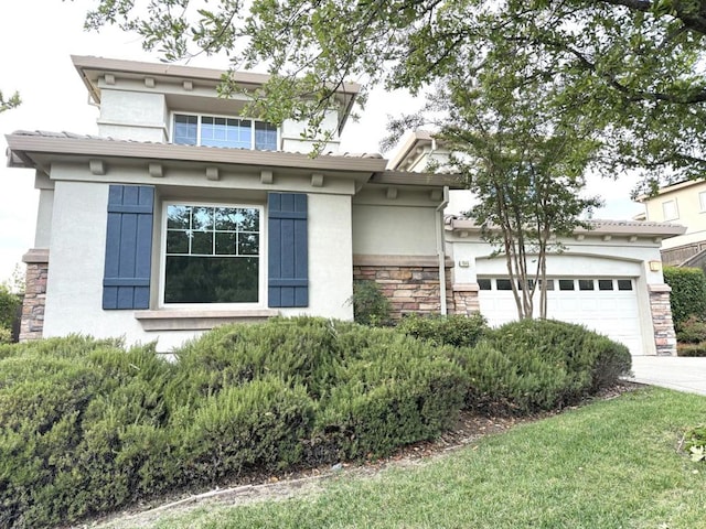 view of front of property with a garage