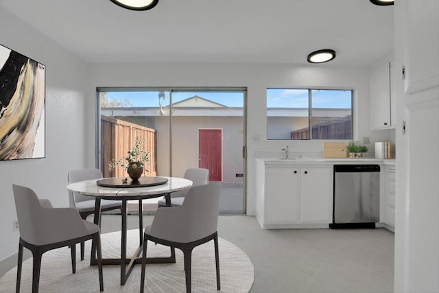 dining room featuring a healthy amount of sunlight and sink