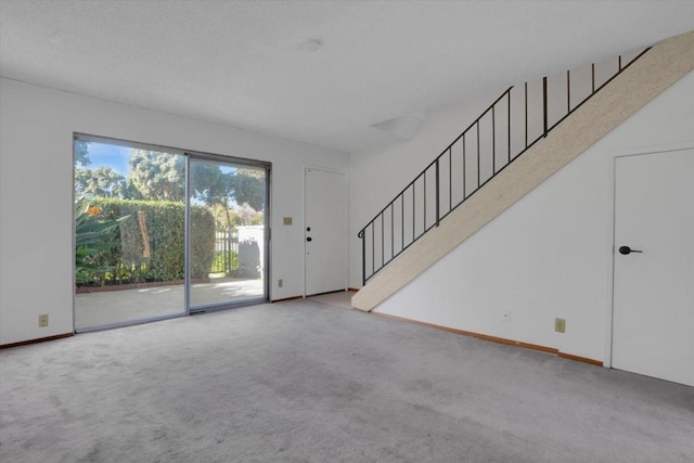 unfurnished living room with carpet floors