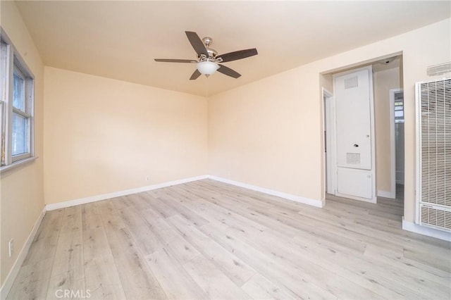 unfurnished room with ceiling fan and light hardwood / wood-style flooring