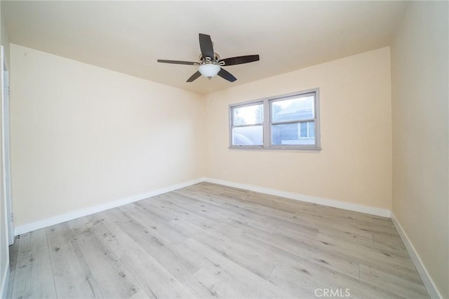 empty room featuring ceiling fan and light wood-type flooring