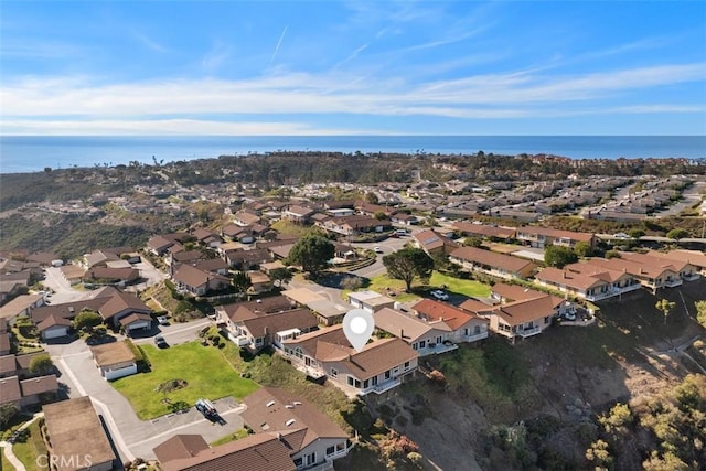 birds eye view of property featuring a water view and a residential view