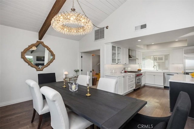 dining room featuring a chandelier, beam ceiling, dark wood-style flooring, and visible vents