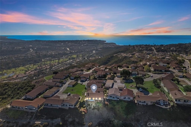 aerial view featuring a water view and a residential view