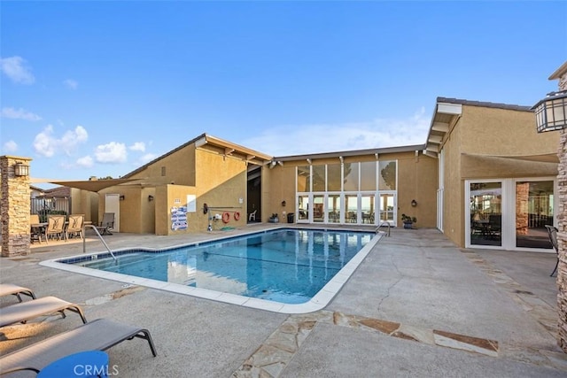 community pool featuring a patio