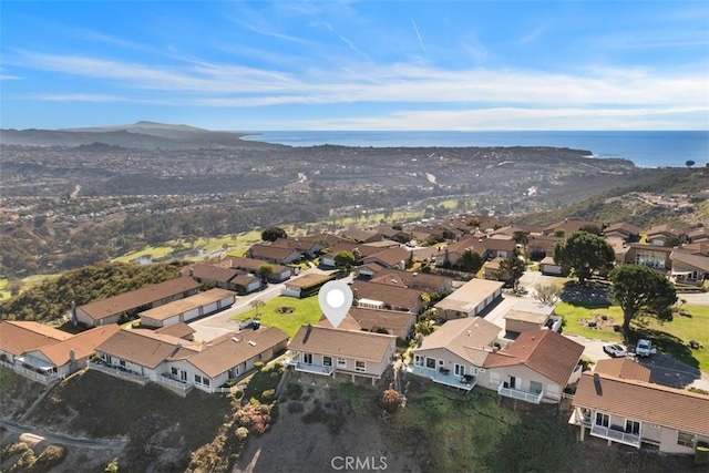 bird's eye view with a water view and a residential view