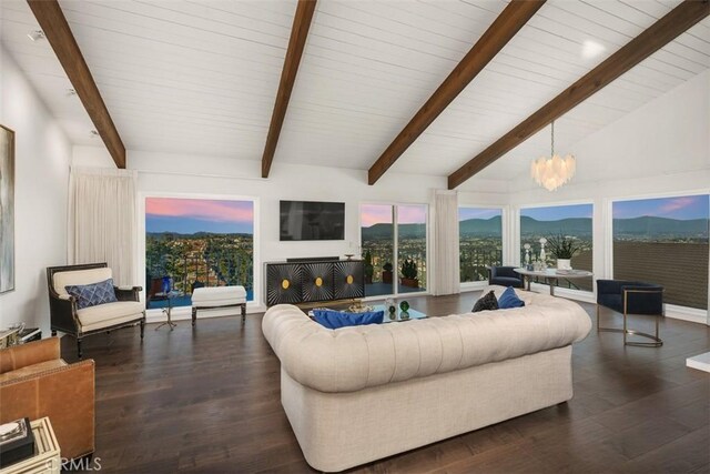 living room with an inviting chandelier, dark hardwood / wood-style floors, and vaulted ceiling with beams