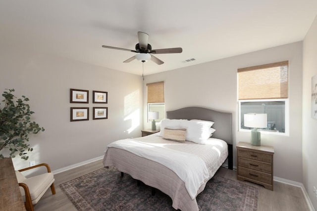 bedroom featuring ceiling fan and dark hardwood / wood-style flooring