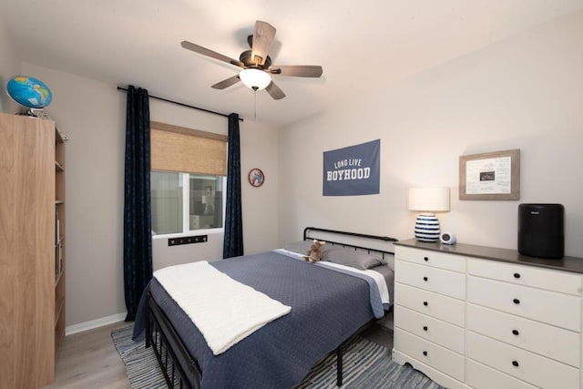 bedroom featuring wood-type flooring and ceiling fan