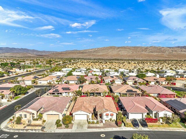 birds eye view of property featuring a mountain view