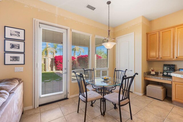 dining area with light tile patterned floors