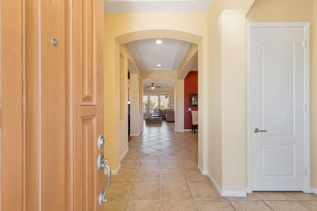 corridor featuring light tile patterned floors