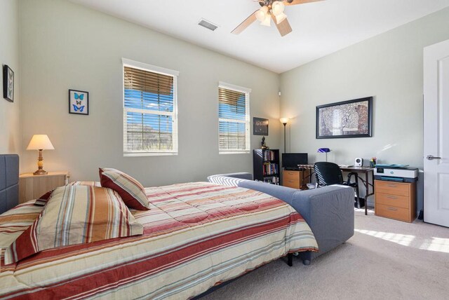 bedroom featuring ceiling fan and light colored carpet