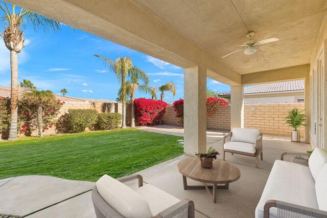 view of patio featuring ceiling fan and an outdoor living space