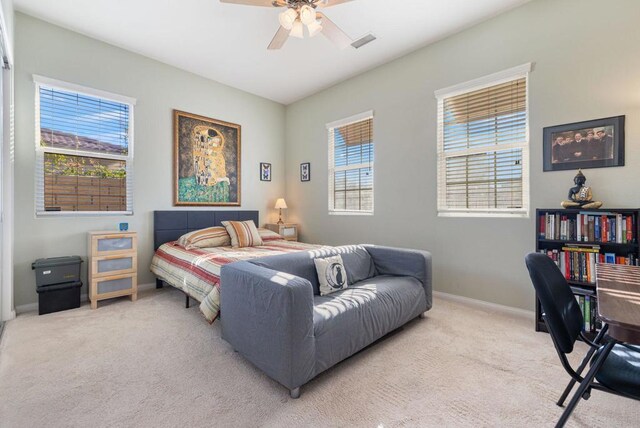 carpeted bedroom with ceiling fan