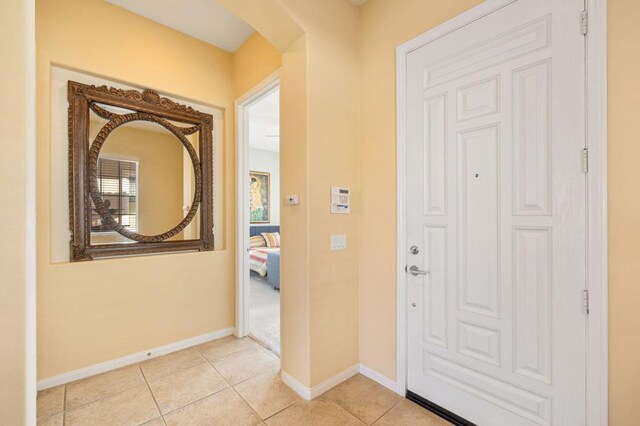 entryway with light tile patterned floors