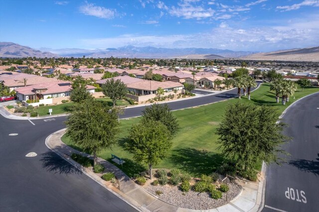 birds eye view of property featuring a mountain view