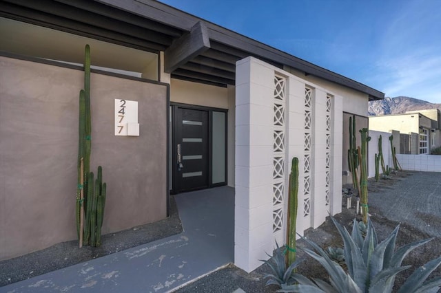 doorway to property with a mountain view