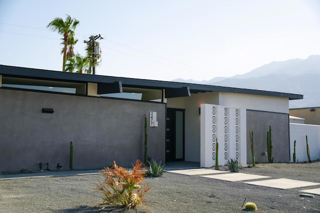 view of building exterior with a mountain view