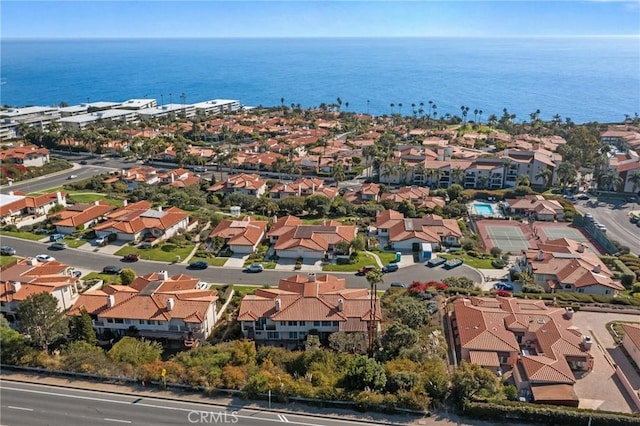 birds eye view of property featuring a water view and a residential view