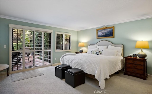 carpeted bedroom featuring ornamental molding and multiple windows