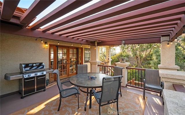 view of patio / terrace featuring french doors, a pergola, and area for grilling