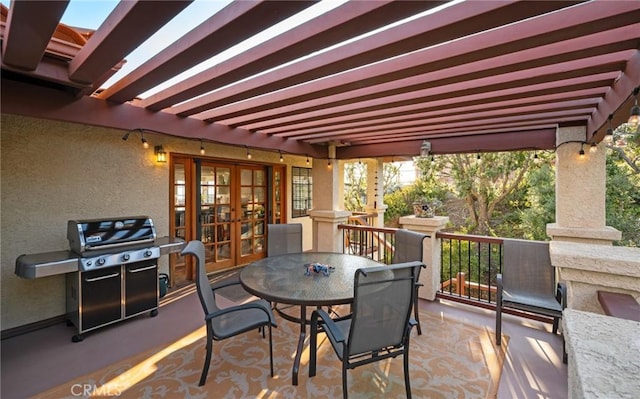 view of patio featuring french doors, outdoor dining area, and a grill