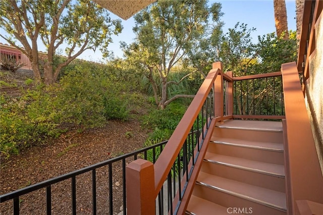 balcony featuring stairs