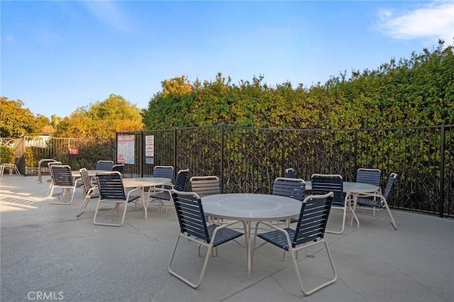 view of patio / terrace featuring fence and outdoor dining space