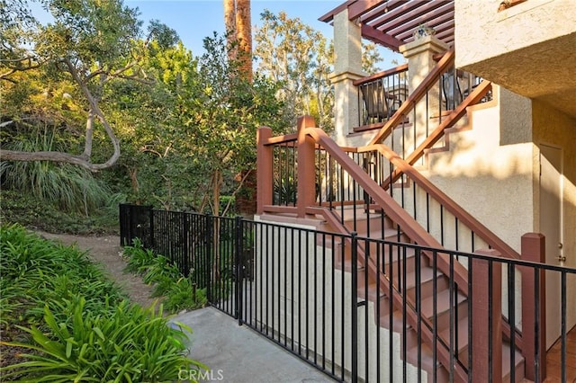 view of gate with stairs