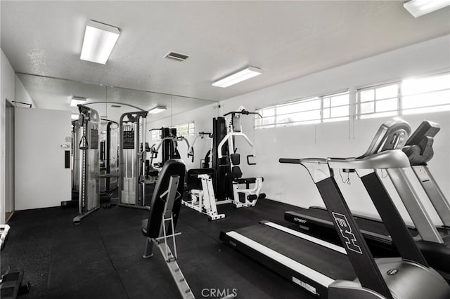 exercise room featuring visible vents