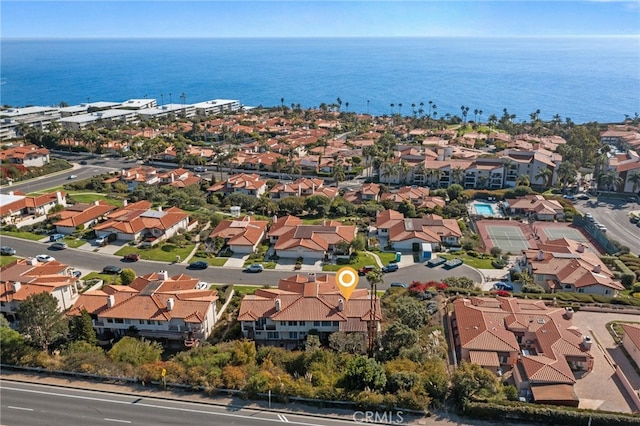 drone / aerial view with a residential view and a water view