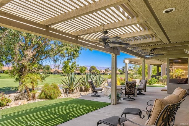 view of patio featuring ceiling fan, outdoor dining space, and a pergola